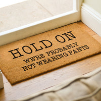 Hold On We're Probably Not Wearing Pants - Funny Door Mat